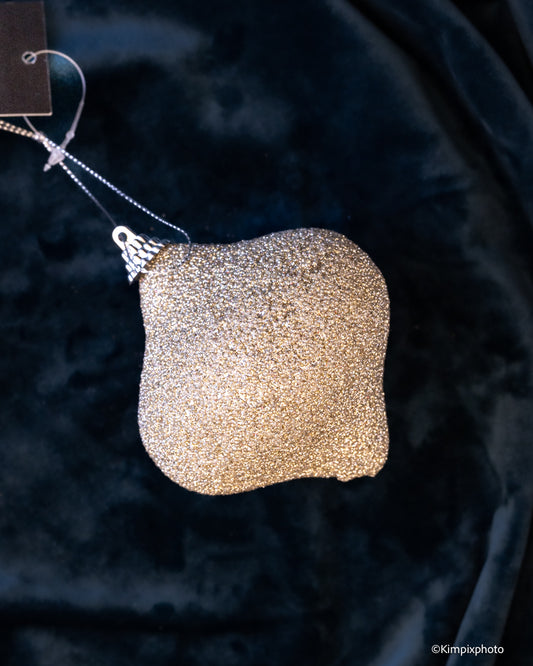 Glitrende dråpe i champagne